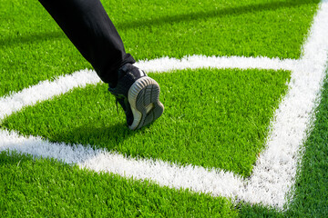 A player takes a corner kick on a brand new soccer field