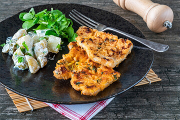 Lemon and thyme pork schnitzel with potato salad