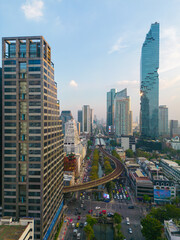 Fototapeta na wymiar Aerial view office city building with Mahanakorn building sunset