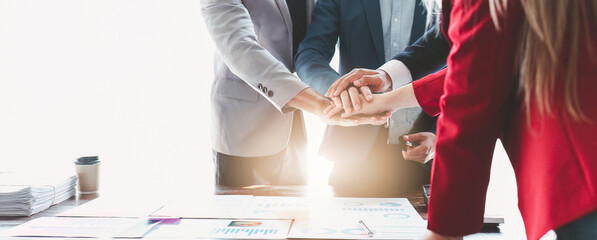 Close up Asian Business people stack of hands working together. Teamwork, Unity, business team concept