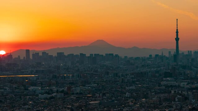 Timelapse video of Tokyo Skytree Christmas tree illumination and greater tokyo magic hour with Mt. Fuji silhouette (Zoom out)