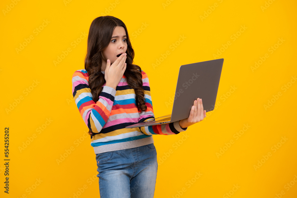 Canvas Prints young student school girl, studying with laptop computer. e-learning concept. shocked amazed face, s