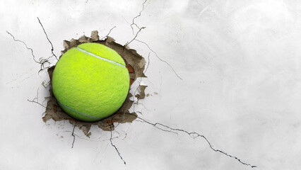 tennis ball pierced the cement wall. tennis sport concept power strength