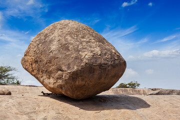 Krishna's butterball - balancing giant natural rock stone. Mahabalipuram, Tamil Nadu, India