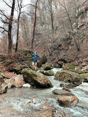 hiker in the forest of Luxembourg on a rainy winter day