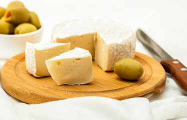 Fototapeta na wymiar Cheese plate and olives. Mediterranean food.