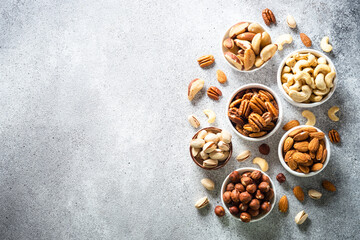 Assortment of nuts in bowls. Cashew, hazelnuts, pecan, almonds, brazilian nuts and pistachios.