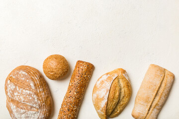 Homemade natural breads. Different kinds of fresh bread as background, top view with copy space