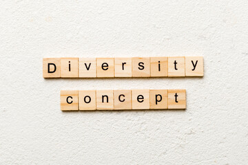 Diversity concept word written on wood block. Diversity concept text on cement table for your desing