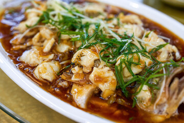 A delicious Chinese dish, steamed sea bass fillets
