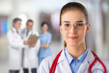 Young happy female doctor in clinic