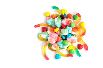 Fototapeta na wymiar On a white isolated background, children's jelly candies with multi-colored dragees lie in bulk.
