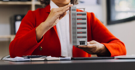 Businessman and team analyzing financial statement Finance task. with smart phone and laptop and...