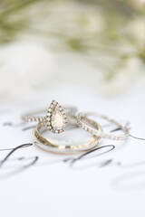 Bride diamond wedding ring and engagement band in a invitation