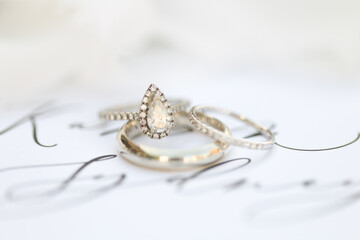 Bride diamond wedding ring and engagement band in a invitation