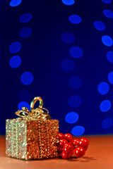 Christmas gifts.Glowing festive garland on a blue background with backlight, beautiful bokeh. New Year's card.The concept of the New Year.	