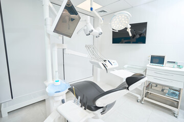 Treatment room interior with dental equipment in dentistry clinic