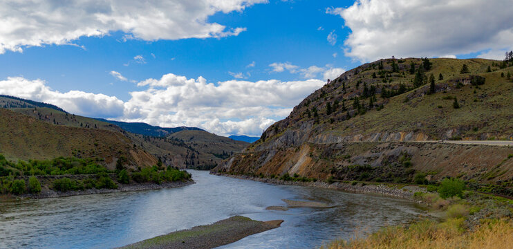 River flowing through a mountainous landscape in Interior BC, on a drive North from Surrey to Likely, BC, Canada; British Columbia, Canada