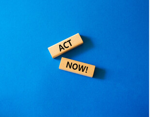 Act now symbol. Wooden blocks with words Act now. Beautiful blue background. Business and Act now concept. Copy space.