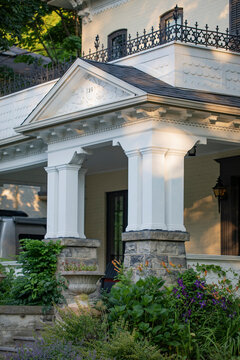 Charming residential architecture with white facade and stonework; Kitchener, Ontario, Canada