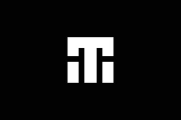 Minimal Awesome Trendy Letter MT Or TM Logo Design Template On Black Background
