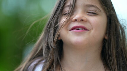 Fototapeta premium Adorable small girl portrait face with milk teeth missing smiling child