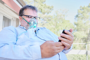 Overweight senior man who needs oxygen supply calls an emergency telemedical care service....