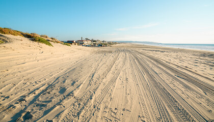 Tire tracks on sandy beach. Oceano Dunes Vehicular Recreational Aria, California State Park allows  vehicles to drive on the beach