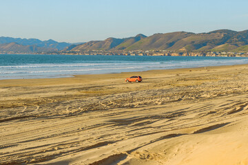 Oceano, California, USA -December 14,  2022.  Cars on the beach. Oceano Dunes, California Central Coast, the only California State Park that allows  vehicles to drive on the beach