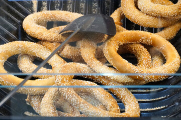 Simit or gevrek, traditional Turkish pastry food display in a market, Turkish street food circular...