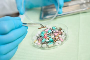 Experienced dentist preparing to perform teeth-polishing procedure