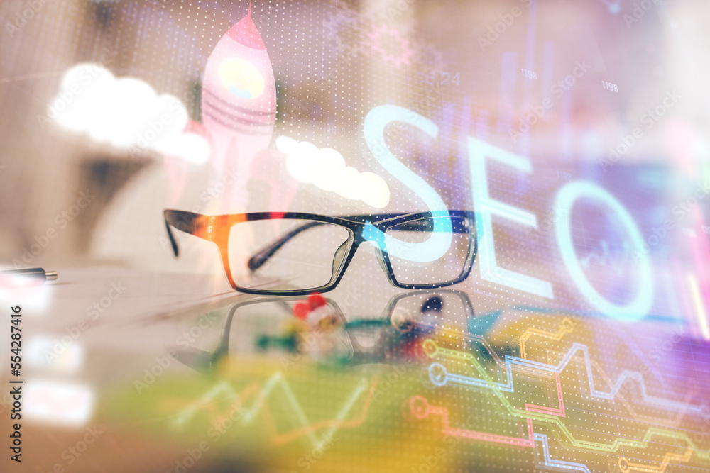 Poster seo hologram with glasses on the table background. concept of search engine optimization. double exp