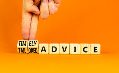 Timely or tailored advice symbol. Concept words Timely advice and Tailored advice on wooden cubes. Businessman hand. Beautiful orange background. Business timely or tailored advice concept. Copy space