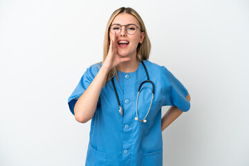 Young surgeon doctor woman isolated on white background shouting with mouth wide open