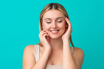 Fototapeta premium Portrait of pretty young woman over blue isolated background