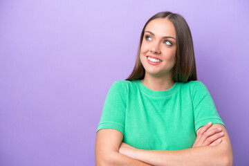 Young caucasian woman isolated on purple background happy and smiling