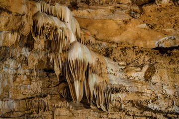 Bizarre and fabulous karst deposits, stalactites and stalagmites in the New Athos Cave in Abkhazia