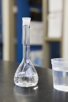 Close-up of a glass with a volumetric flask