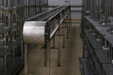 Metal machinery in the cheese factory for the production of cheese