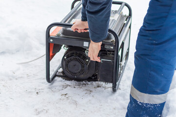natural light. shallow depth of field. snow. an autonomous generator for generating electricity. close-up