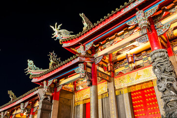 Night view of Xingtian Temple building in Taipei, Taiwan. The temple is devoted to Lord Guan. In...