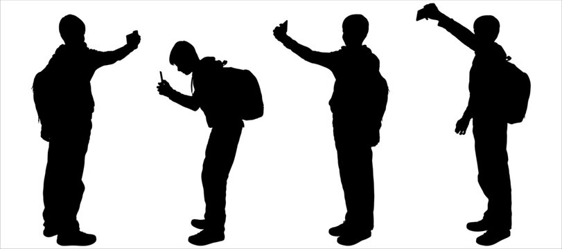 Teenagers take photos with smartphones. Boy use selfie-camera. Posing teenager. The boy sat down to take a picture with his phone. Side view, profile. Four black silhouettes isolated on white