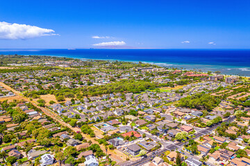 Aerial view of Kihei Town and the rooftops of commercial and residential buildings along the Pacific Coast; Maui, Hawaii, United States of America