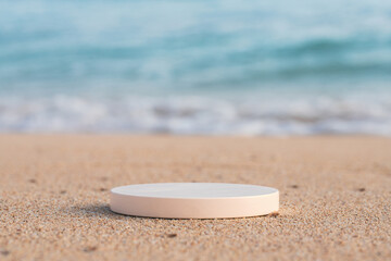 Fototapeta na wymiar Empty round white platform podium on the beach