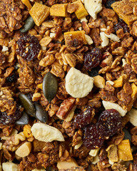 Greek yogurt with granola, dried fruit, and honey drizzle.