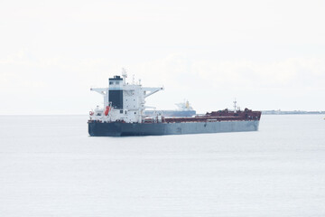 Old cargo ship docked in open sea