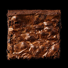 A rich, fudgy brownie with a glossy, crackled top, isolated on a black background to accentuate its...