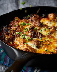 Cheesy buldak, a spicy Korean chicken dish covered with toasty melted cheese.
