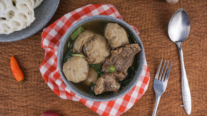 Image of Indonesian meat balls ‘‘bakso” homemade, served in ceramic bowl. Selective focus. Flat lay concept