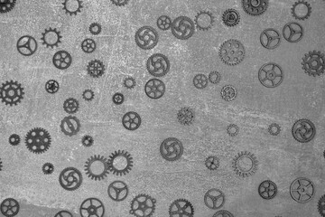 Abstract, gray concrete background with gears.
